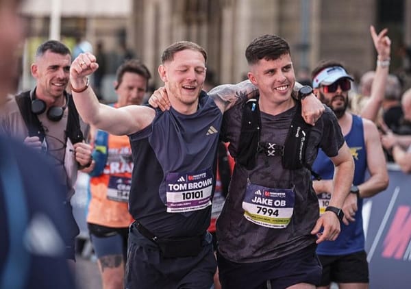Tom Brown (left) and Jake O'Brien are pictured after completing the Manchester Marathon