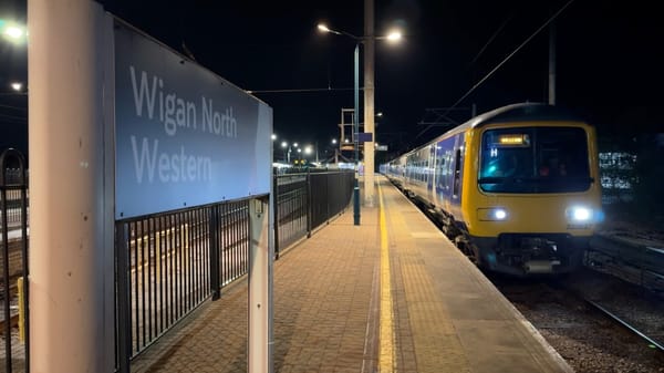 The first electric train leaves Wigan North Western station on Tuesday